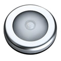 Silver circular wireless motion sensor night light on a table showing its 80mm diameter.