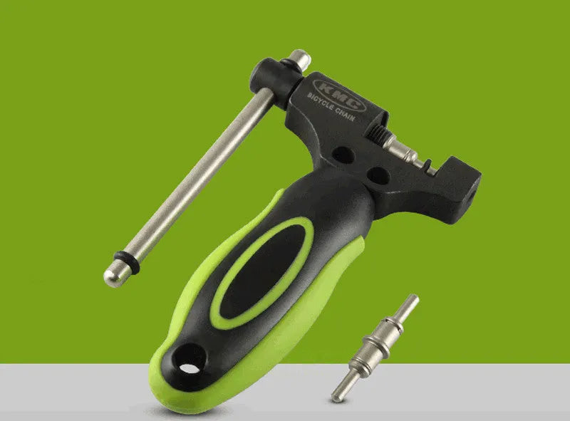 Green steel bicycle chain cutter tool with a double shaft device and a separate chain driver on a white background.