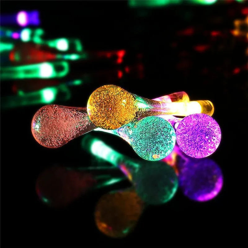 6.5 metre solar LED fairy lights with 30 warm white bulbs and bubble drop pendant design