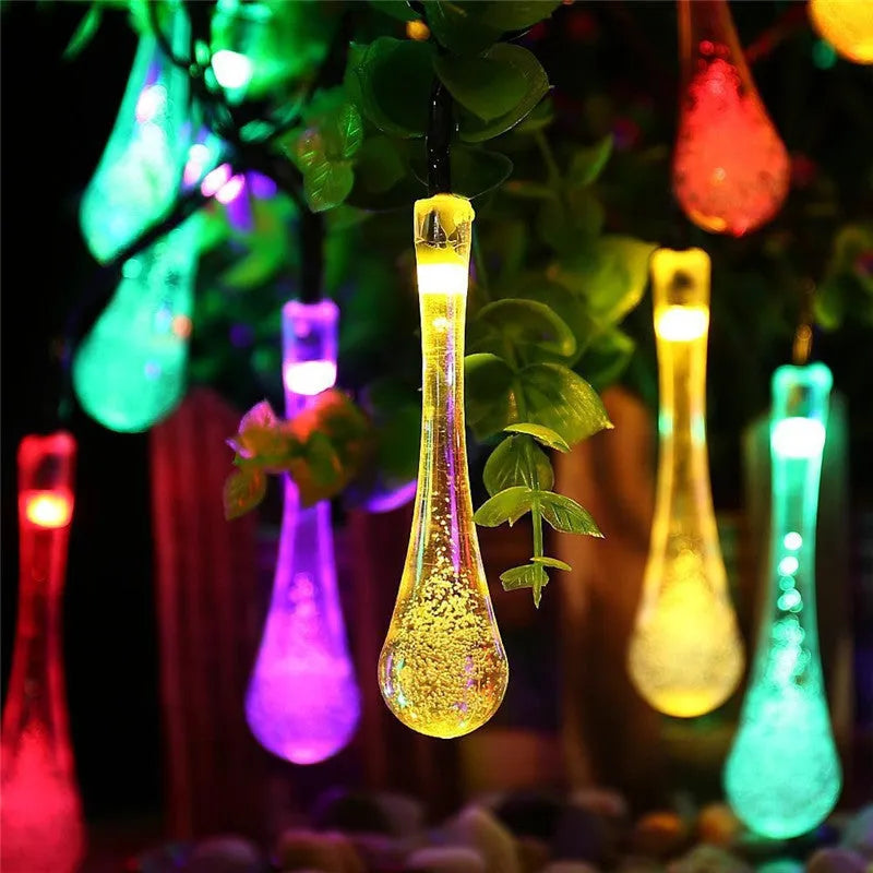6.5 metre solar LED fairy lights with 30 warm white bulbs and bubble drop pendant design