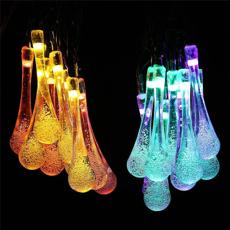 6.5 metre solar LED fairy lights with 30 warm white bulbs and bubble drop pendant design