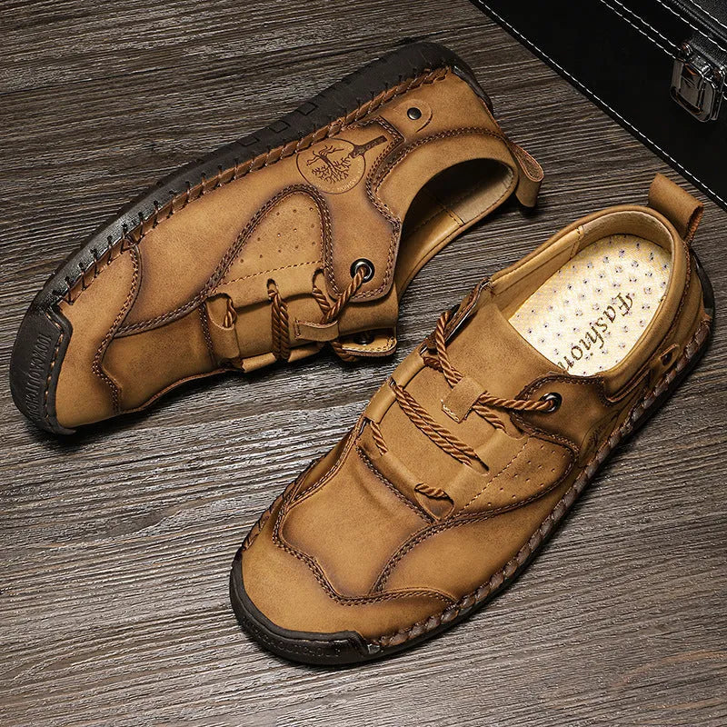 Men's black casual leather shoes with round toe and plain microfiber upper.