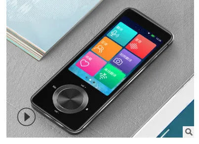 Small gold M9 electronic language translator for group chat and photo translation on a table.