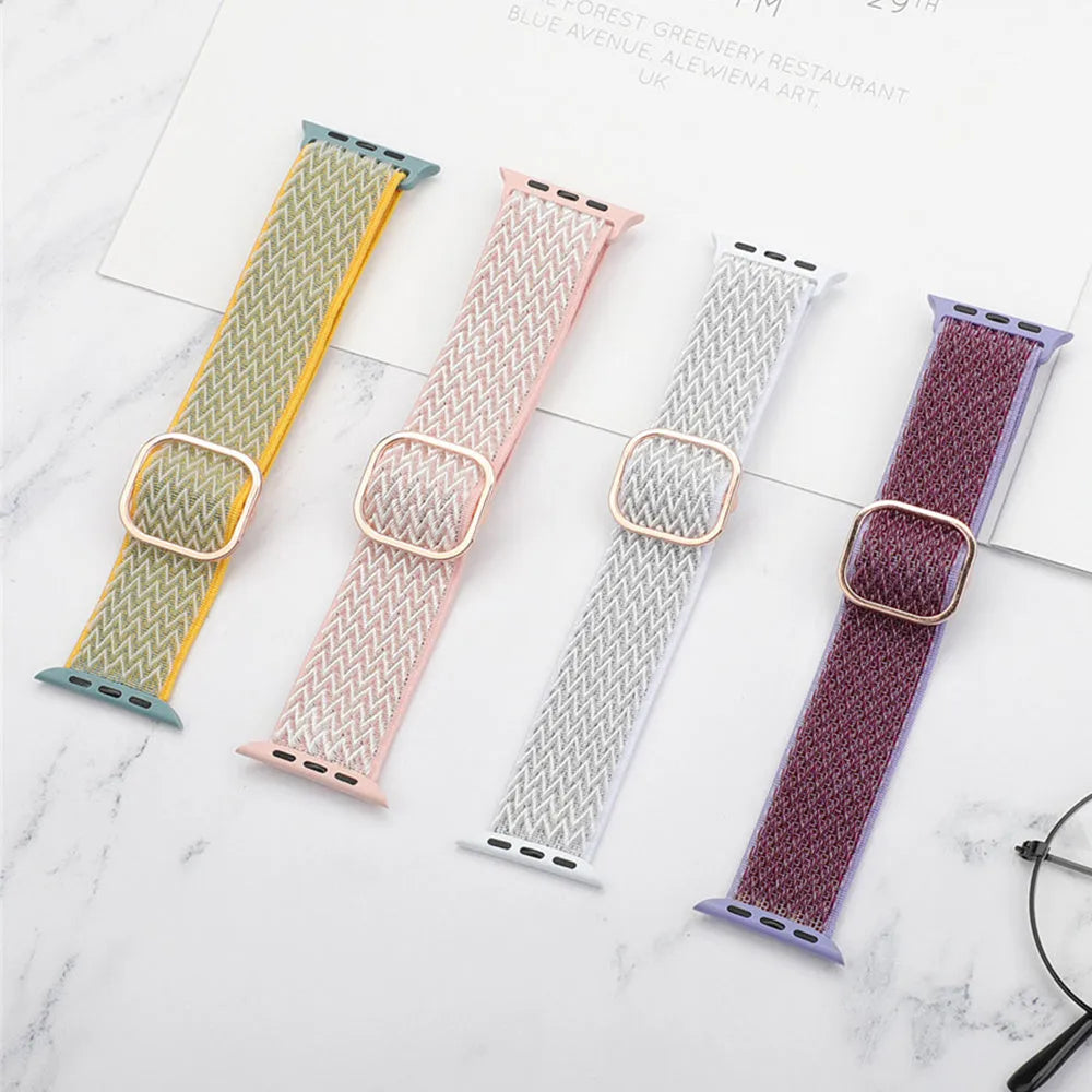 Braided nylon Apple Watch strap with a wave pattern, shown in a choice of colours on a wrist.