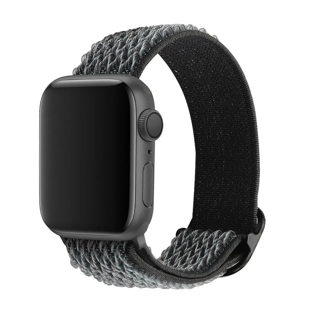 Braided nylon Apple Watch strap with a wave pattern, shown in a choice of colours on a wrist.