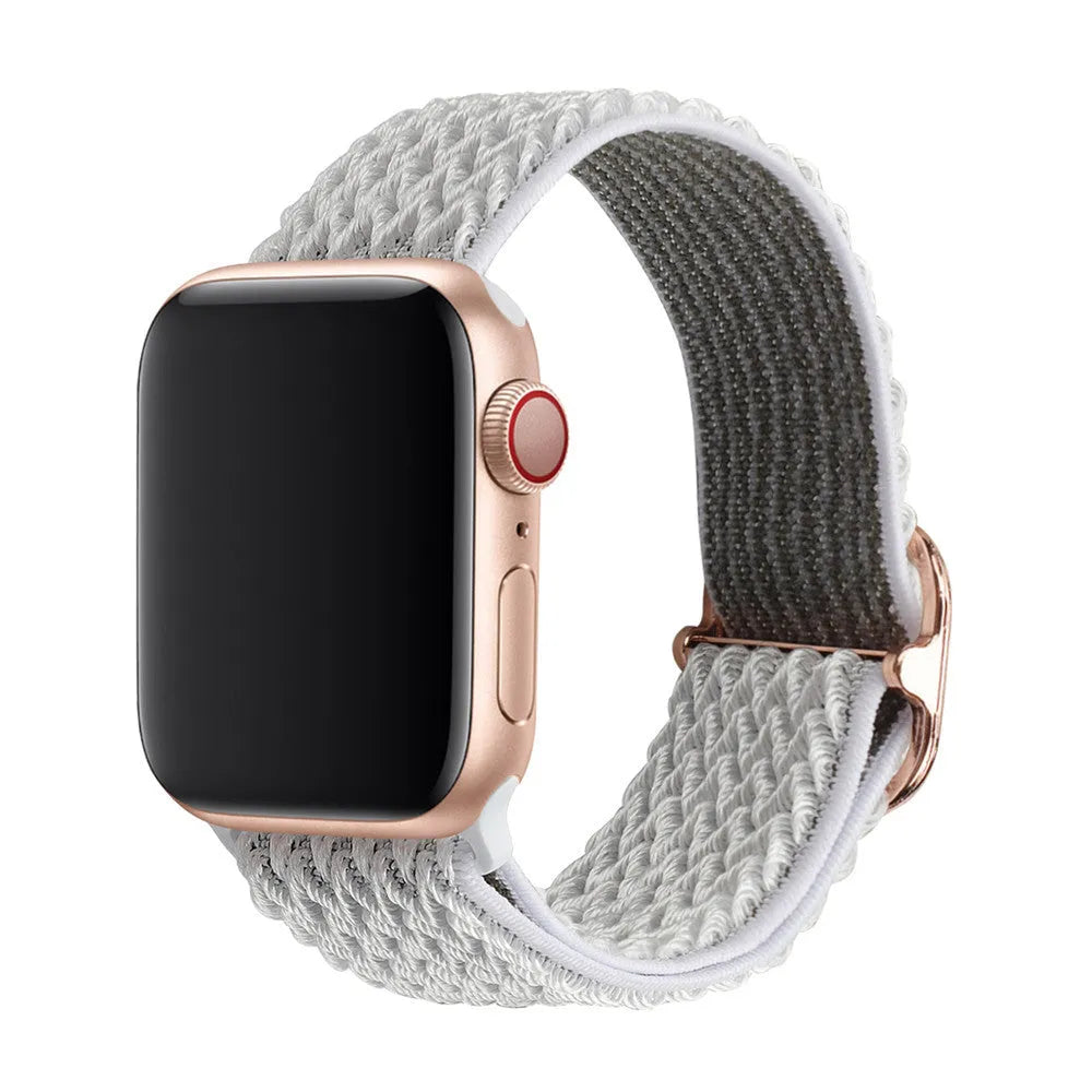 Braided nylon Apple Watch strap with a wave pattern, shown in a choice of colours on a wrist.