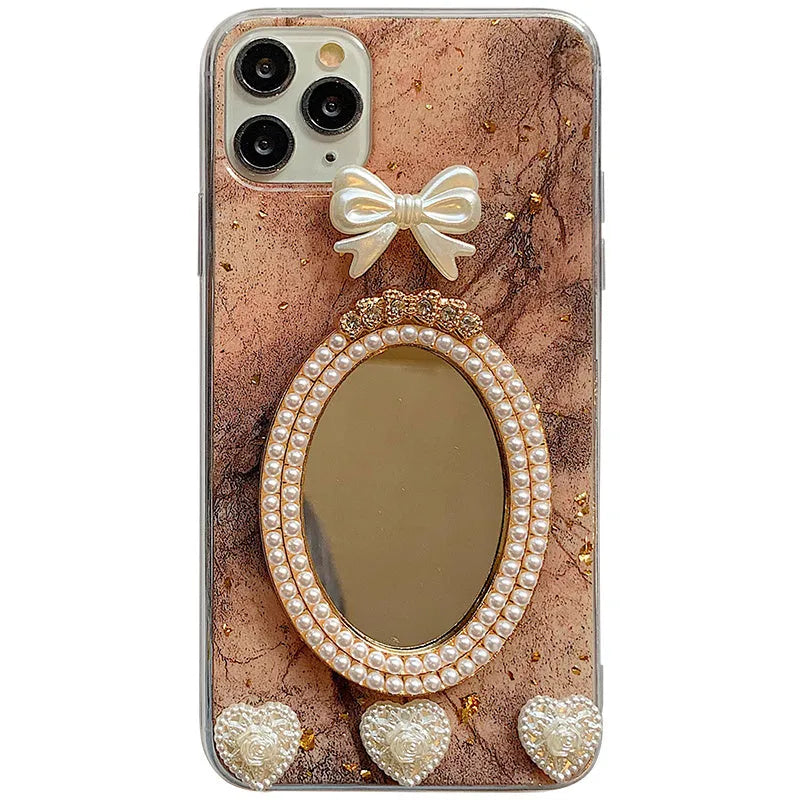 Brown marble pattern iPhone case with a rhinestone bowknot and mirrored back.