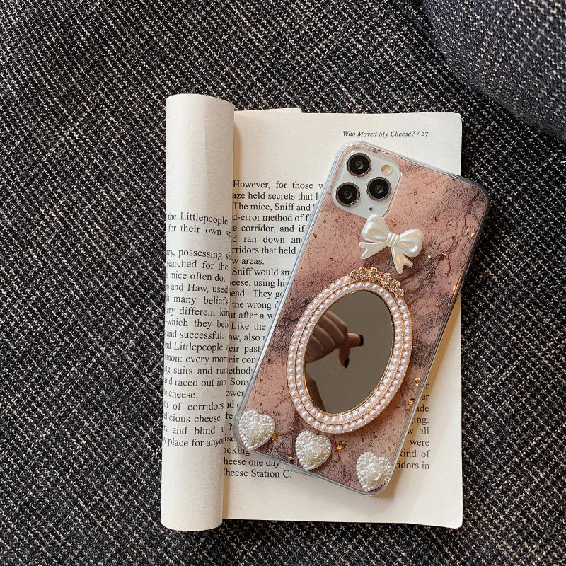 Brown marble pattern iPhone case with a rhinestone bowknot and mirrored back.
