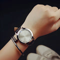 Casual digital wristwatch with blue luminous display and electronic movement in black or white.
