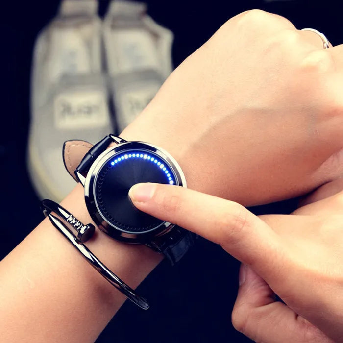 Casual digital wristwatch with blue luminous display and electronic movement in black or white.