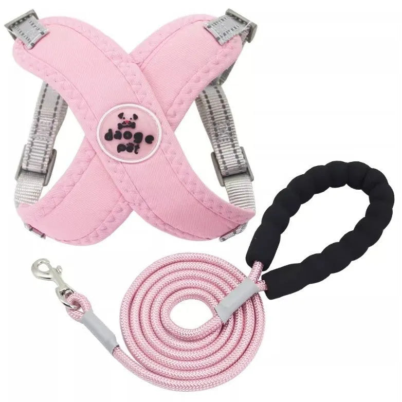 Blue adjustable polyester dog harness vest with a matching hand holding rope on a white background.