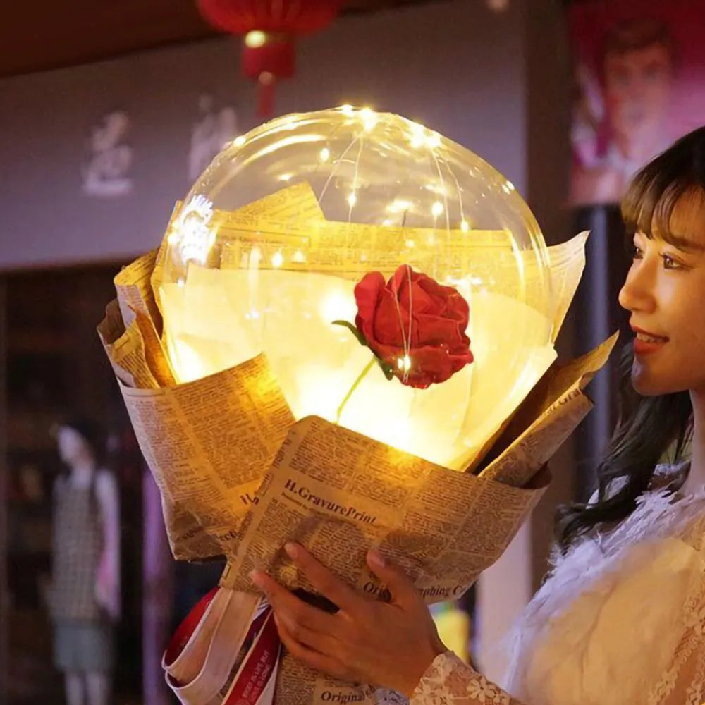 DIY LED luminous transparent balloon with artificial rose and lights inside for decoration.