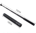 Black retractable selfie stick extended with phone in holder and visible wrist strap.