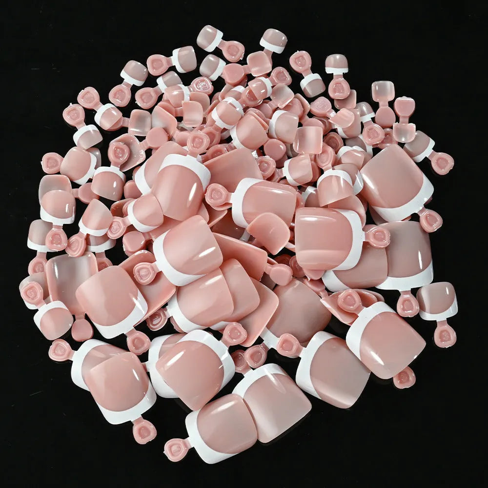 Box of 120 French white edge nude full square short artificial nail pieces showing nine colour shades