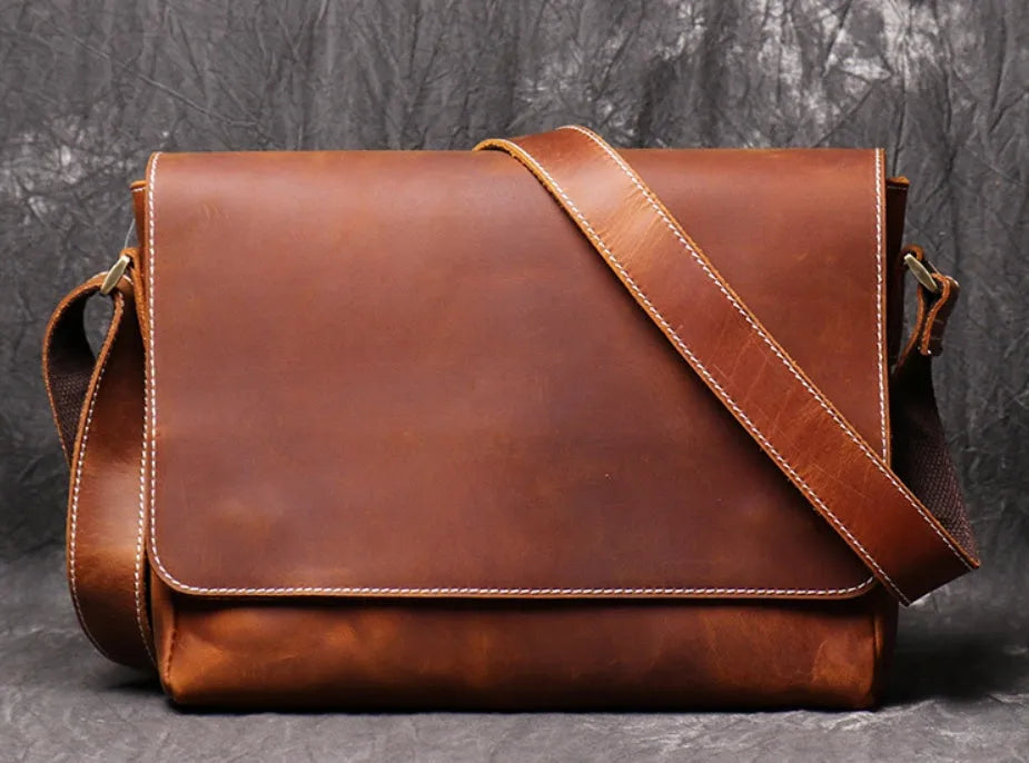 Men's vintage brown leather messenger bag with flap cover and adjustable shoulder strap