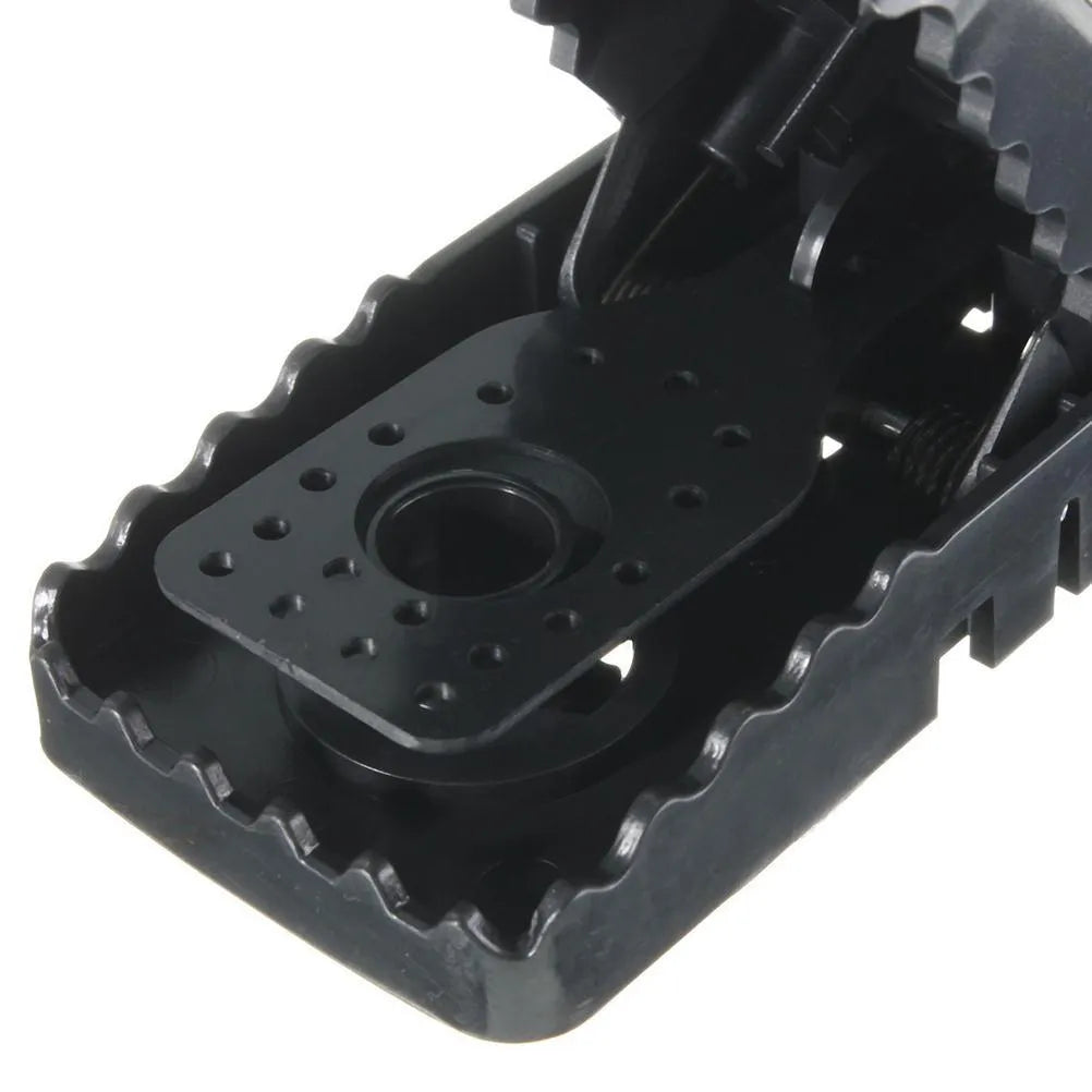 Six black snapping mousetraps made from alloy plastic with dimensions 11cm by 5cm