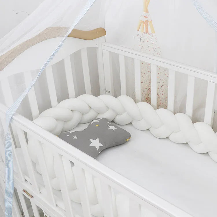 Baby crib bumper in crystal velvet with braid knot design showing flexible length options for cot protection