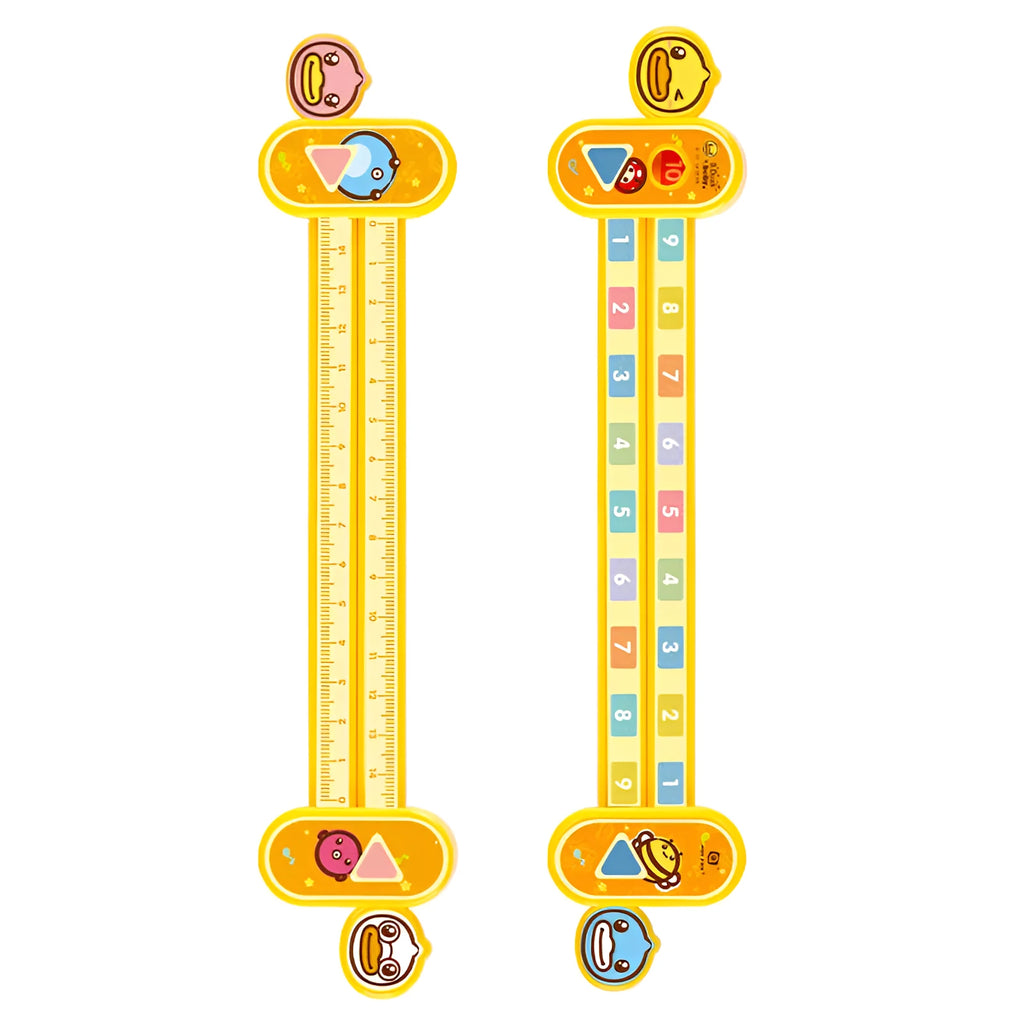 A yellow plastic children's cartoon digital decomposition ruler showing measurements up to 24.5 cm.