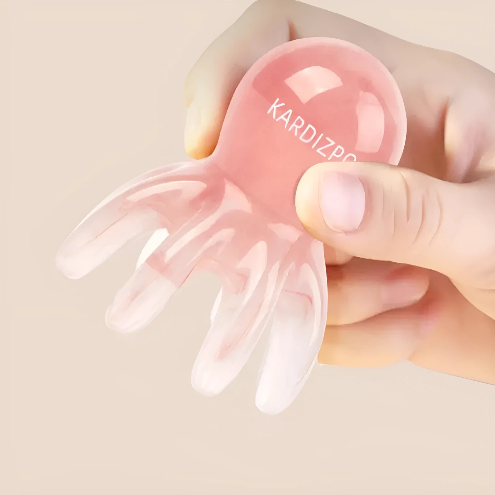 Small pink octopus-shaped massage comb for facial meridian and periocular massage