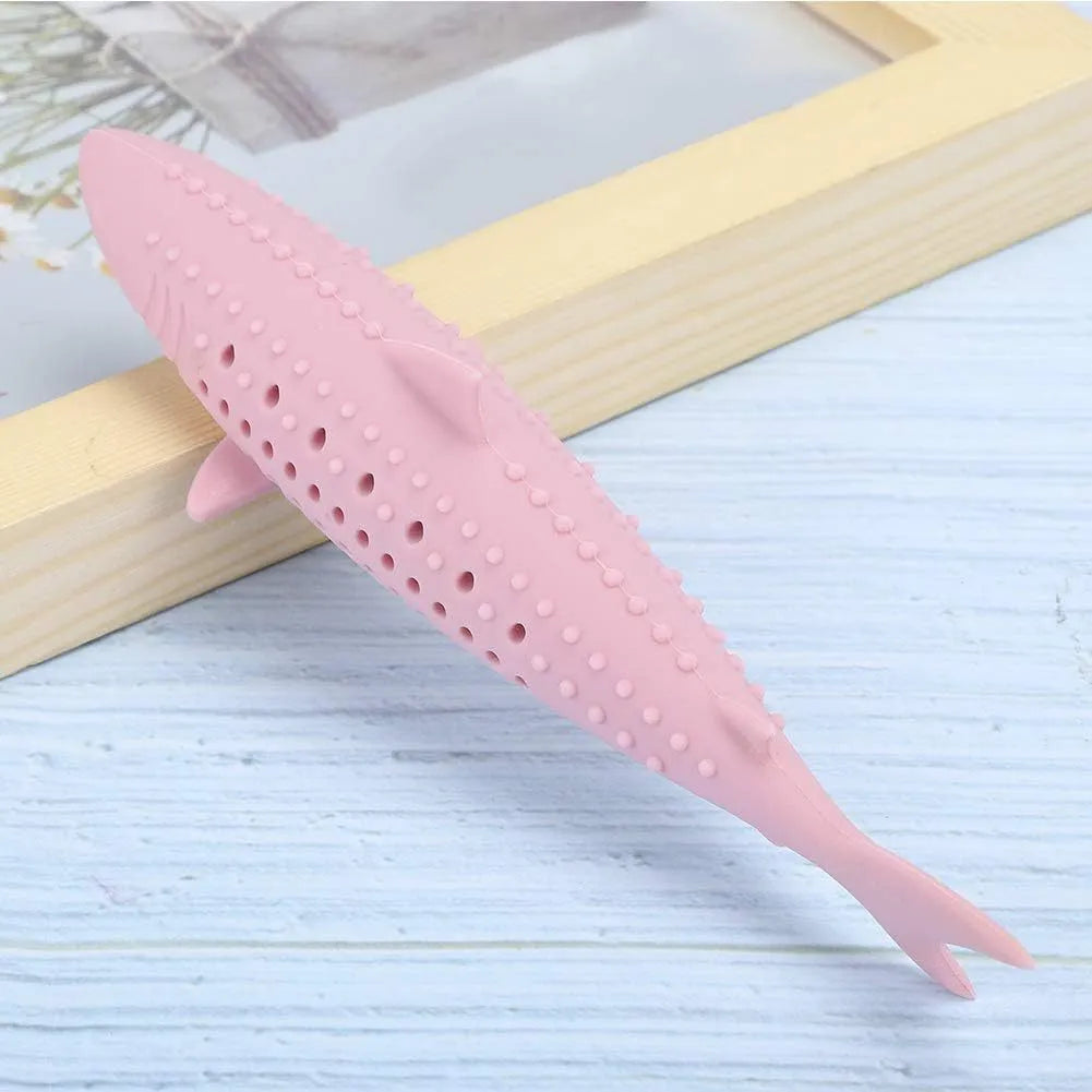 Green silicone fish-shaped cat chew toy with dental cleaning texture and side holes
