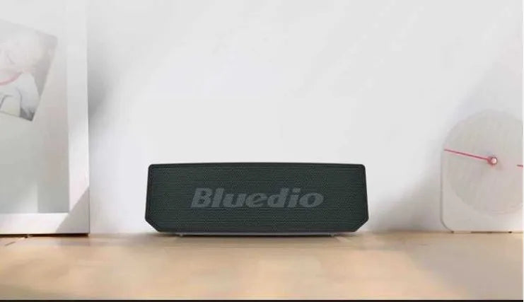 Black Bs-6 compact Bluetooth smart speaker showing front and side.