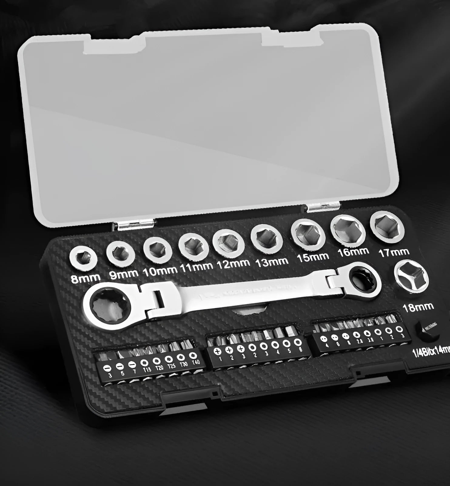 Dual-purpose ratchet wrench set with two-way switch, ten sockets, and three screwdriver bits laid out on a workbench.