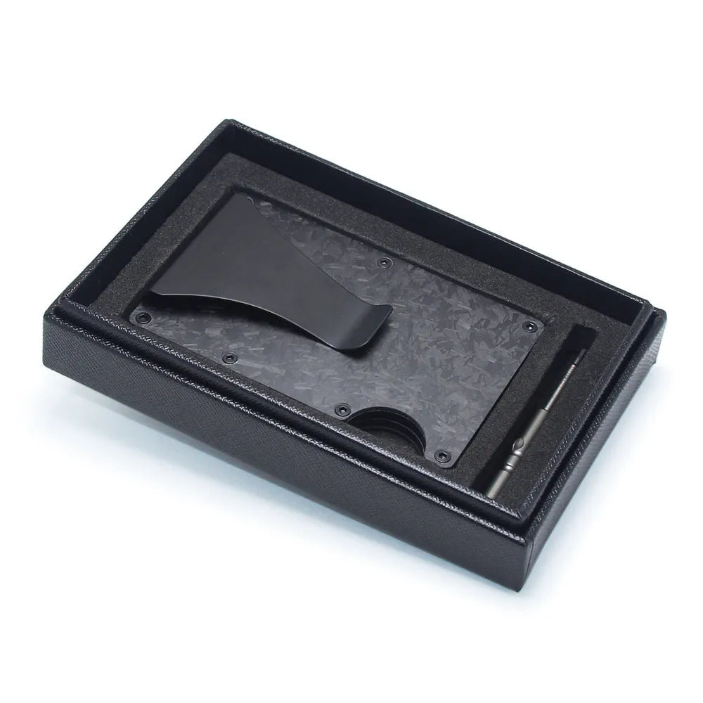 Carbon fibre geometric wallet card holder showing 8mm thickness holding multiple bank cards