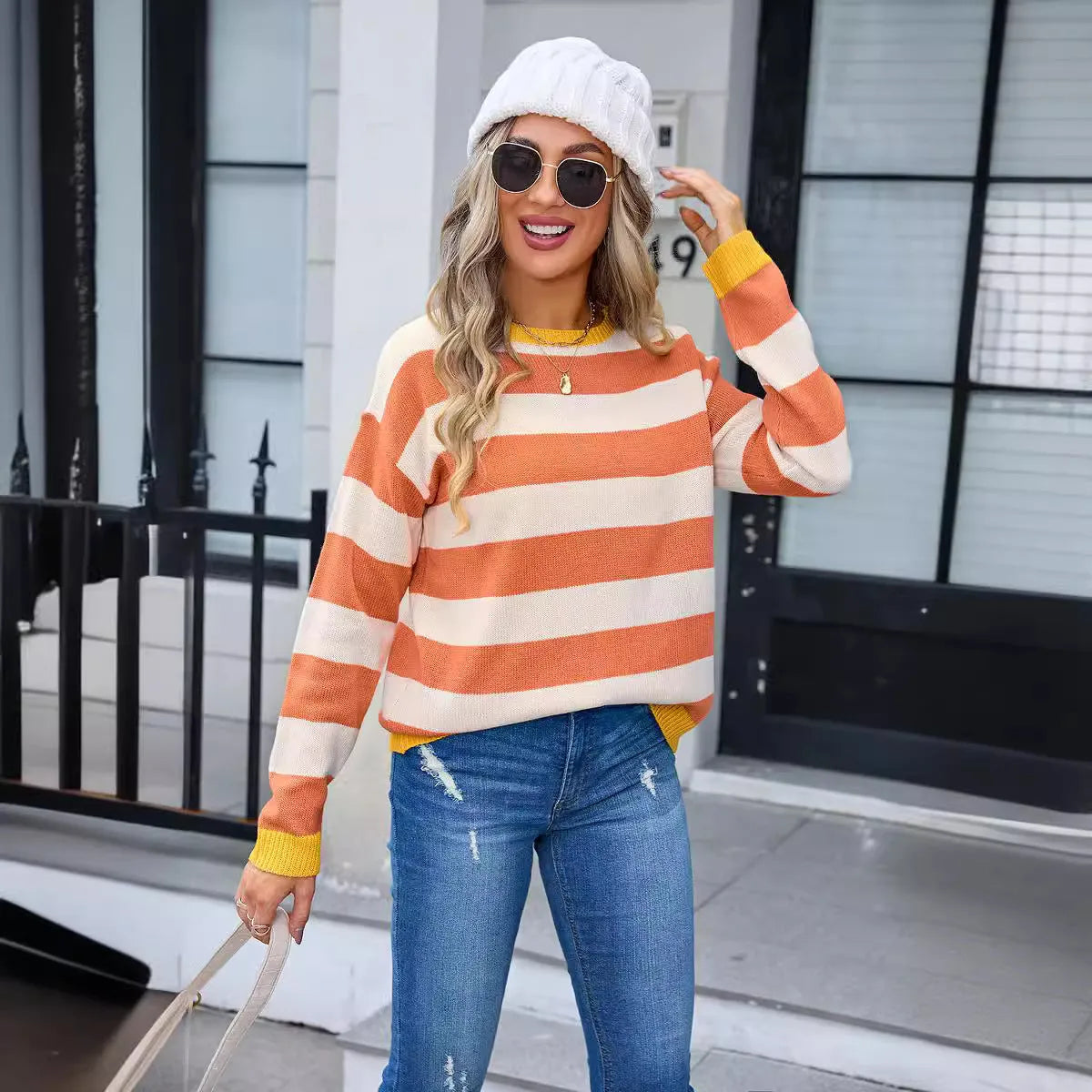 Women's loose fit acrylic sweater in blue colour with round neck and long sleeves