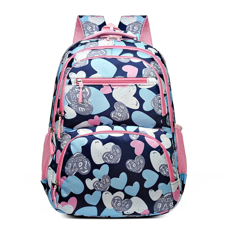 Blue children's schoolbag with air pillow shoulder straps and Oxford cloth exterior.