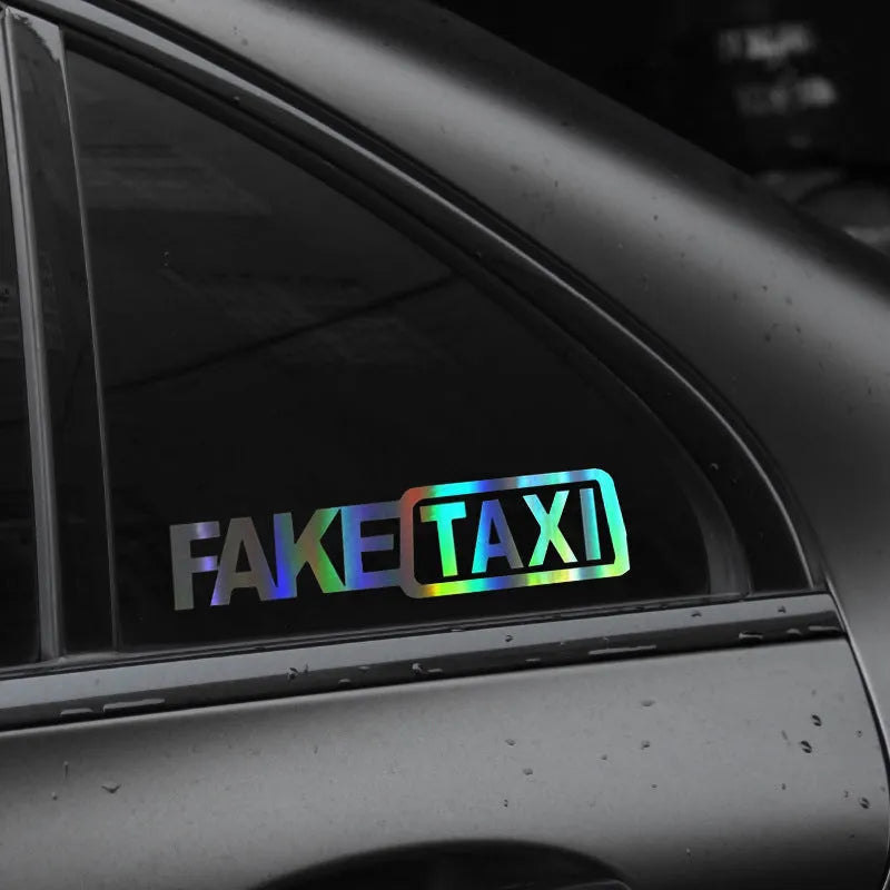 Yellow Fake Taxi waterproof car sticker on a vehicle window, showing 20cm by 8cm size.
