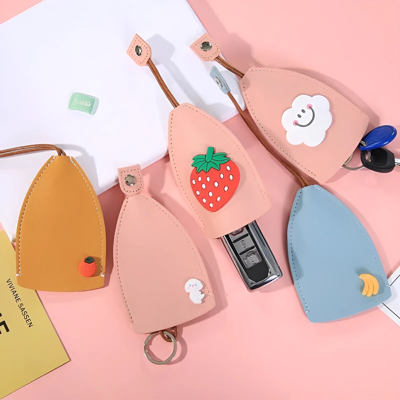 Colourful cartoon pull-out key case made from PU leather, showing the key extended from its protective sleeve.