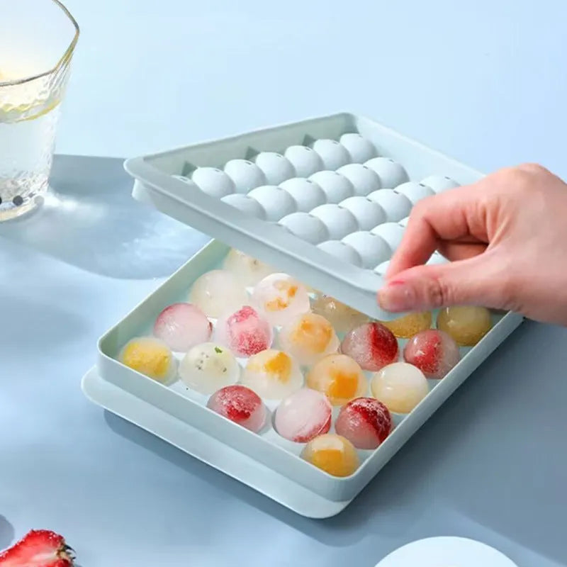 33 grid round silicone ice cube tray with lid in blue or pink measuring 24x14x3cm