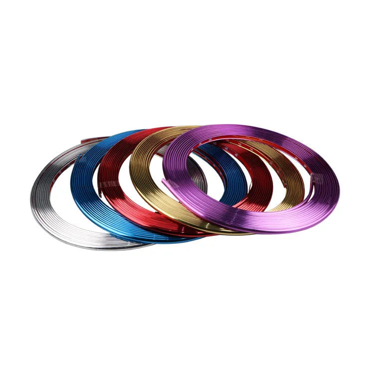 8 metre roll of electroplated purple PVC wheel hub trim strip on a white background.
