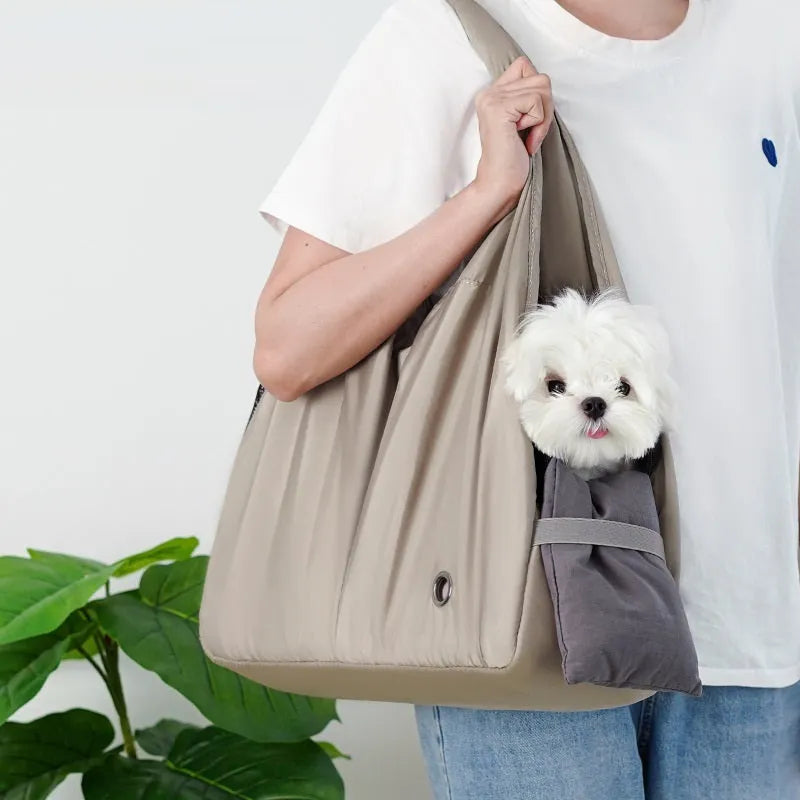 Apricot coloured cloth pet handbag with breathable mesh, shown with dimensions 41cm by 16cm by 28cm