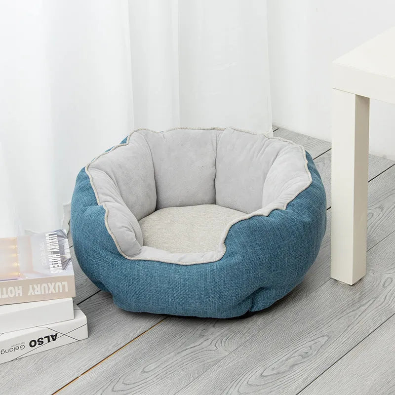 Blue octagonal pet bed with soft wool point design and removable mat for a small dog.