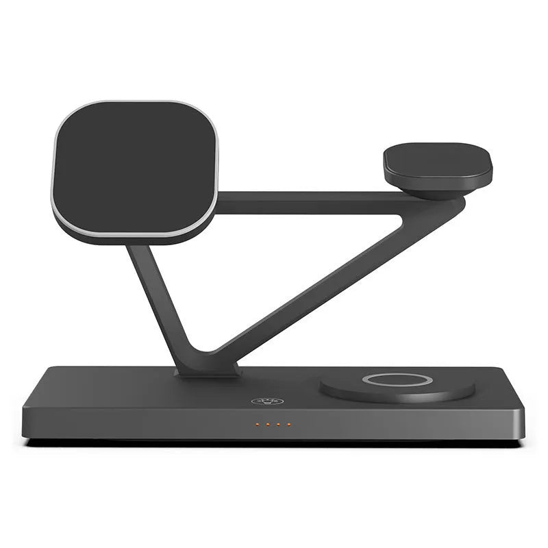 White five-in-one wireless charging station with magnetic phone bracket, circular charger, watch pad, and night lamp on desk.