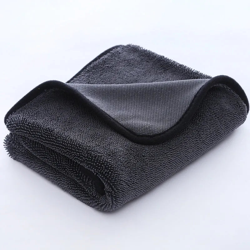 Grey car cleaning towel with black trim edge in various sizes from 20x30cm to 60x160cm.