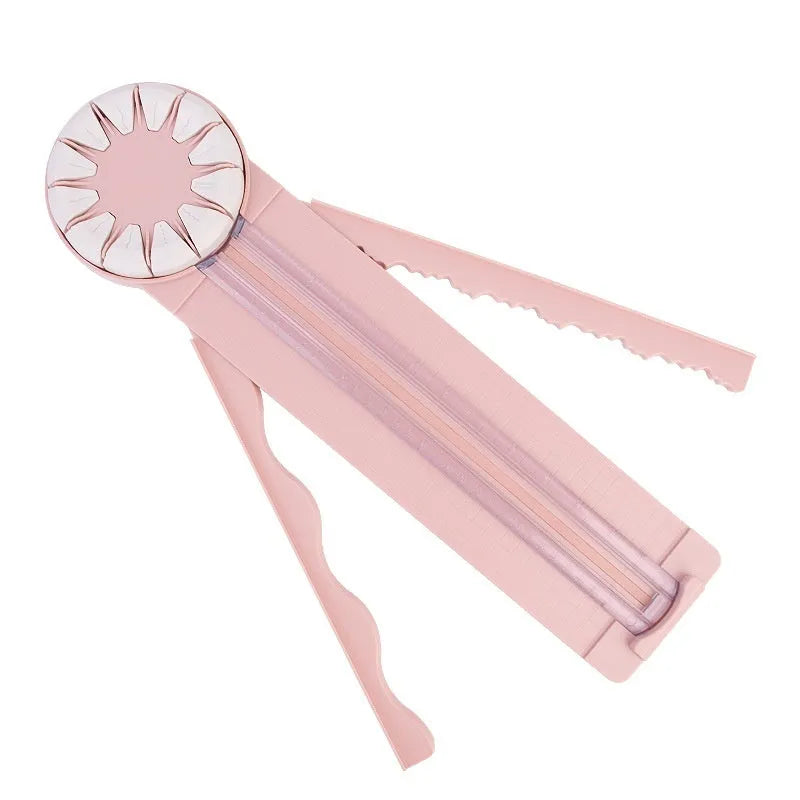 Pink and black plastic paper cutting machine with dotted grid pattern and multiple cutting functions