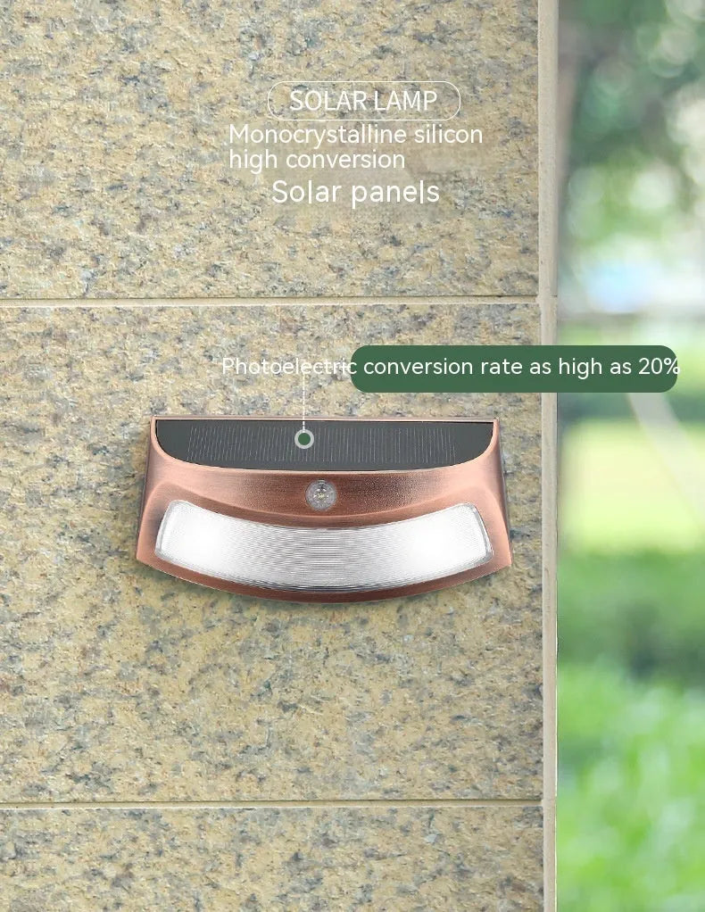 Solar outdoor wall lamp with smiling face design for garden and courtyard lighting