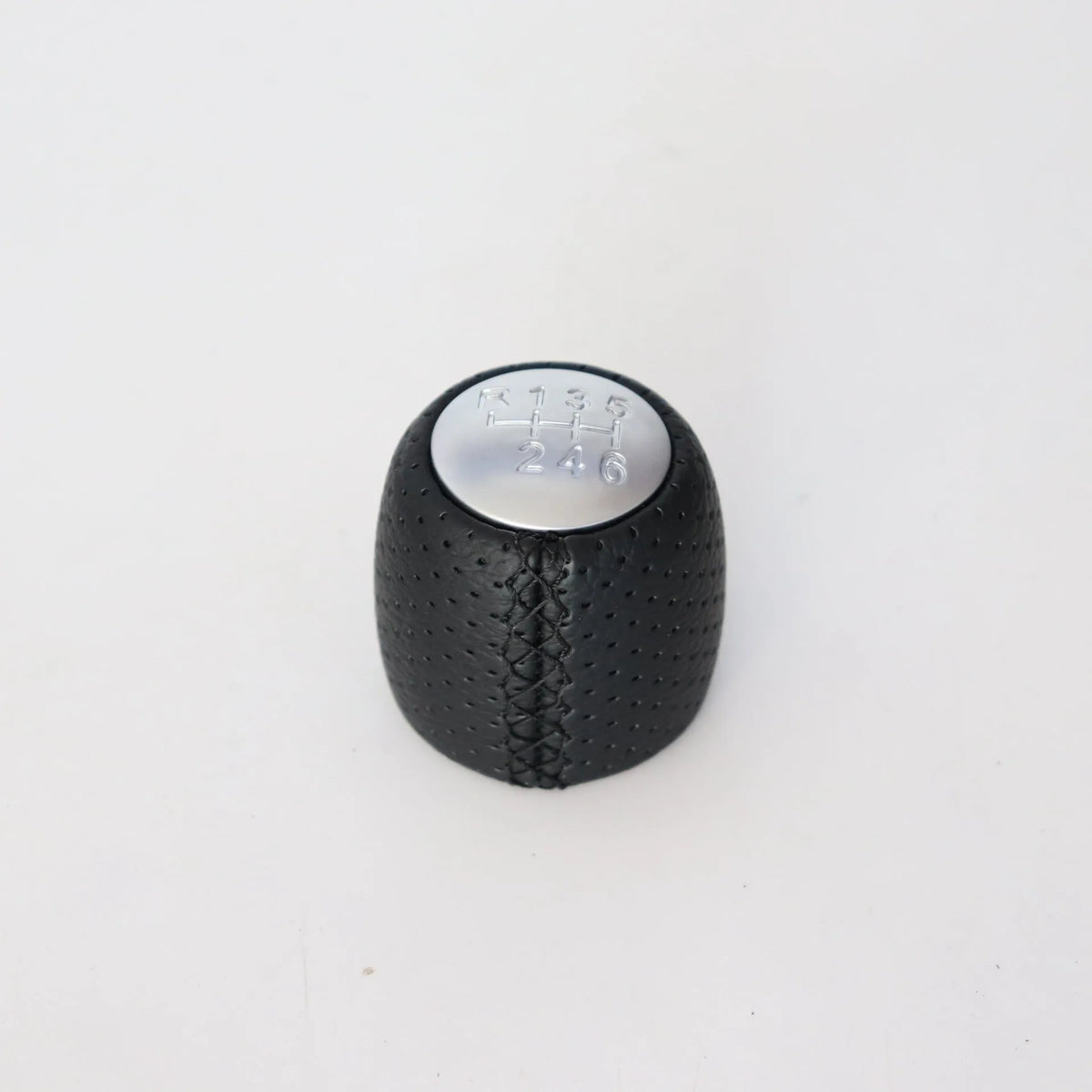 Black perforated PU leather gear knob for Alpha car with sewn seam, shown next to red and white line options.