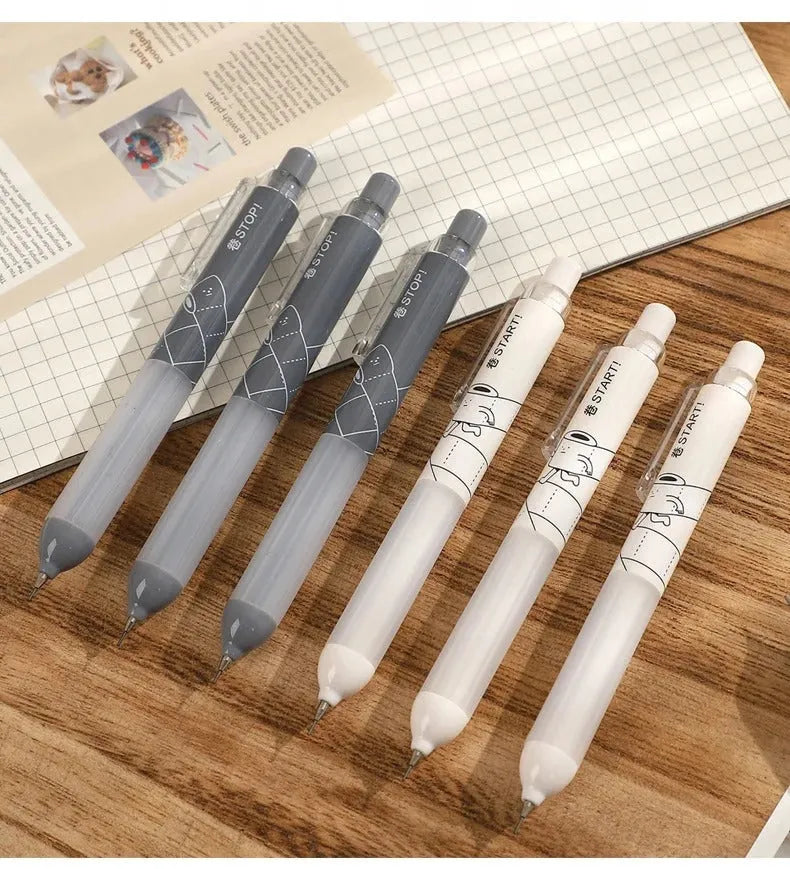 Black and white 0.5mm mechanical pencils with triangular cloud grips on a minimalist background.