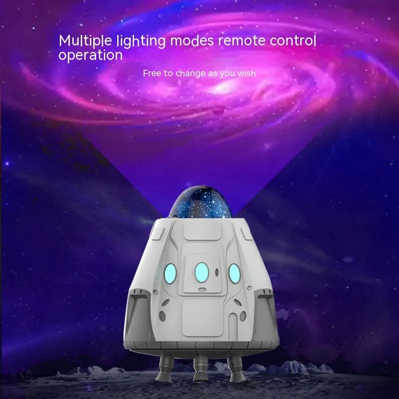 White capsule-shaped Northern Lights ambience light with laser projection on a dark wall