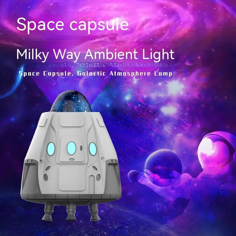 White capsule-shaped Northern Lights ambience light with laser projection on a dark wall