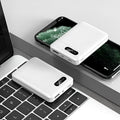 White and black portable power bank showing multi-USB ports and compact 92mm x 63mm x 23mm dimensions