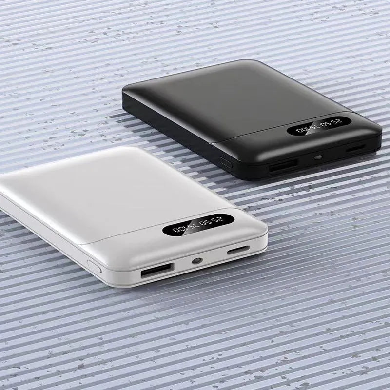 White and black portable power bank showing multi-USB ports and compact 92mm x 63mm x 23mm dimensions