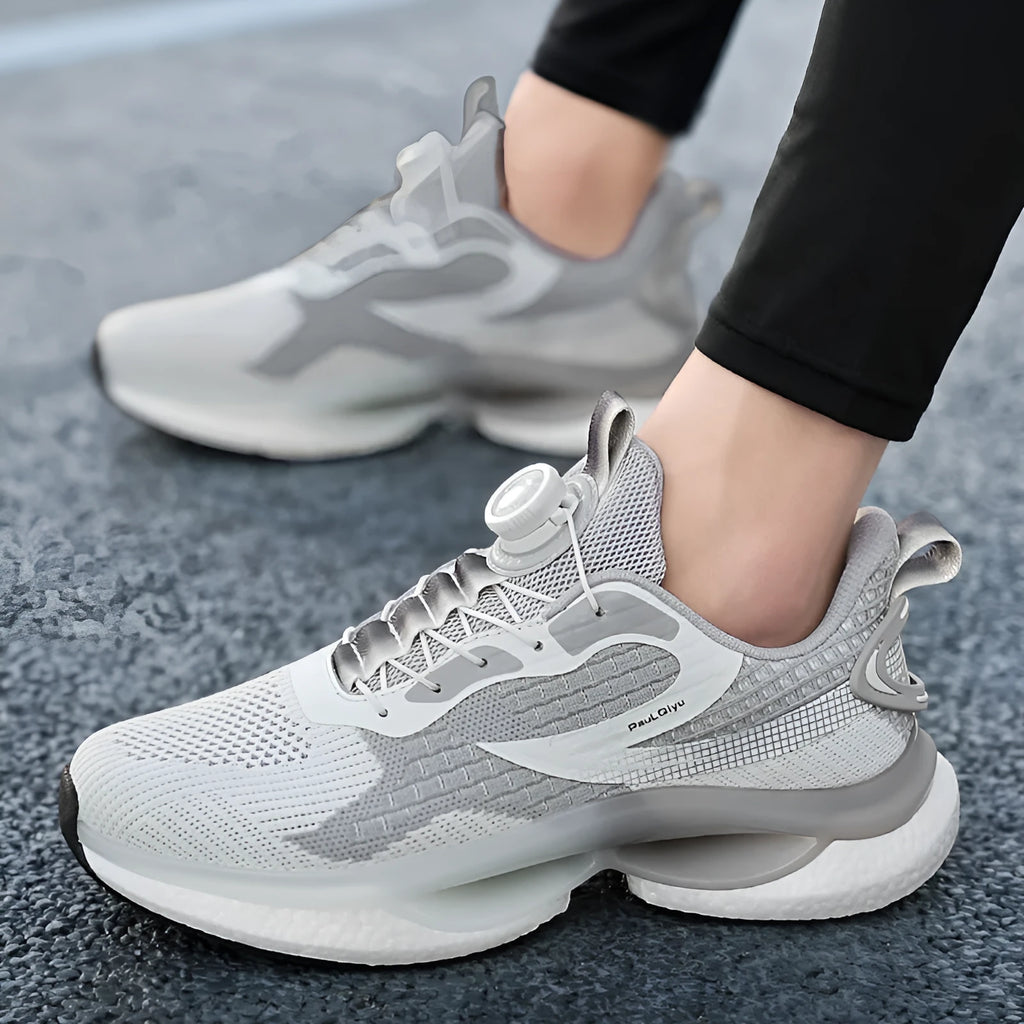 Men's white running shoes with rotating buckle closure and Fly-knit mesh upper