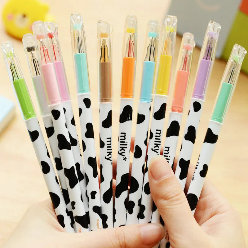 Cow-pattern gel pen set showing 12 different coloured pens with 0.38mm tips