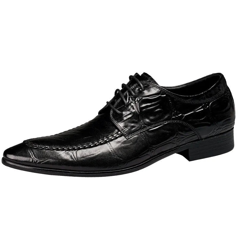 Black men's leather loafers with a silver horsebit buckle on a pointed toe, side view.