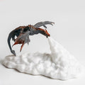 3D printed red dragon lamp lit up with warm glow on a dark surface