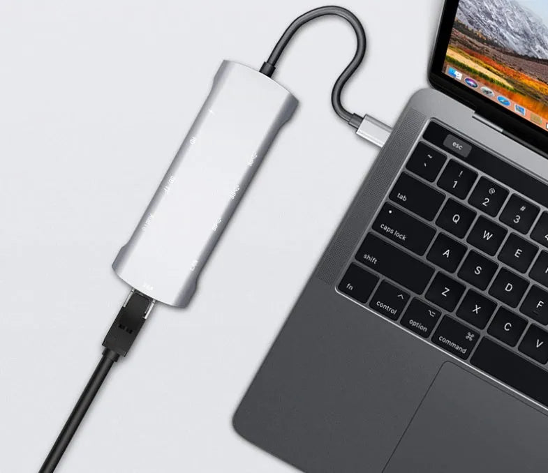 Grey aluminium USB-C docking station with HDMI, VGA, and USB ports